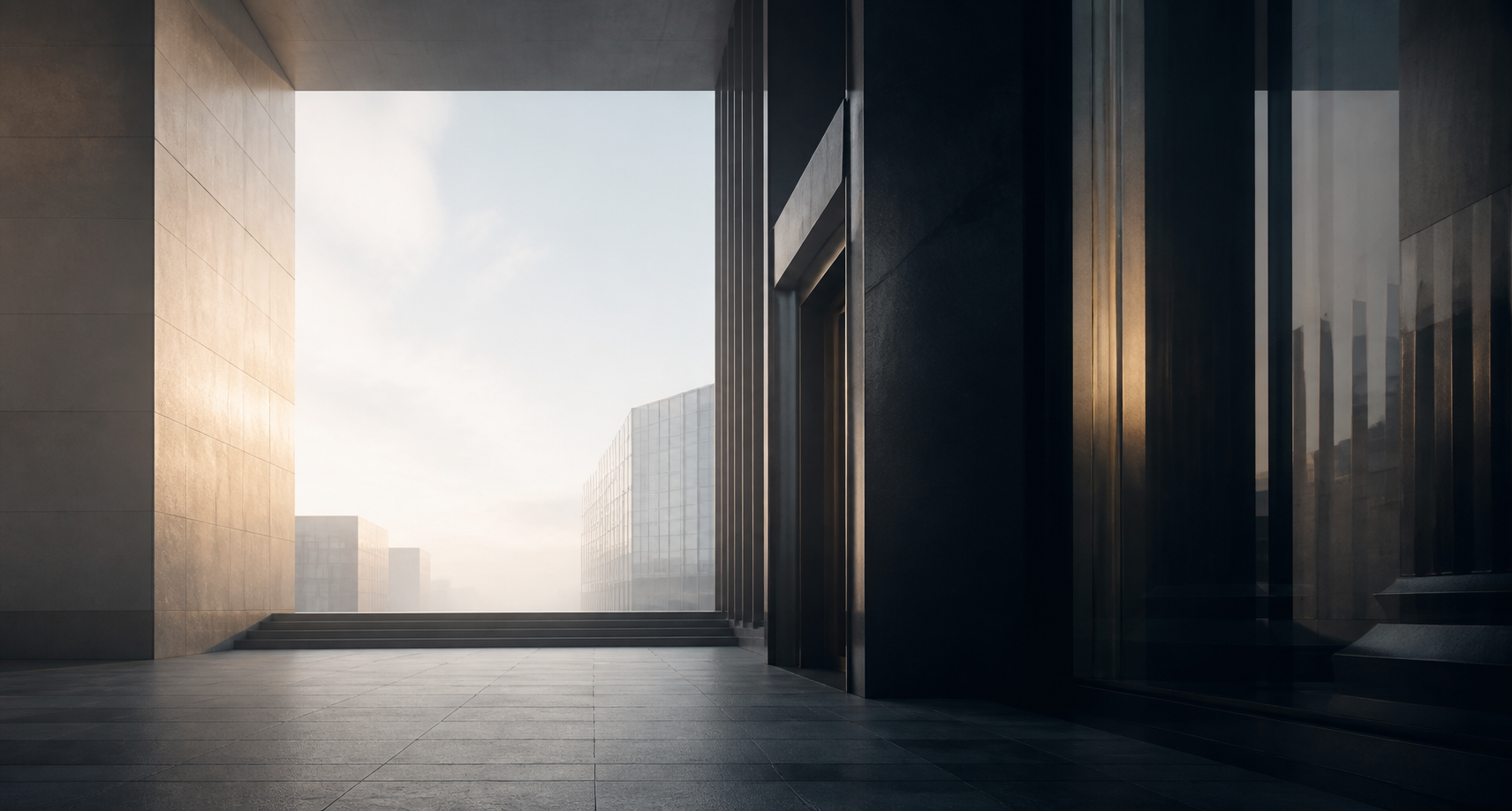 A monumental stone and bronze passage opening toward morning light